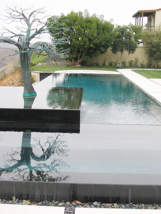 Pool with hot tub, tree and view of hills